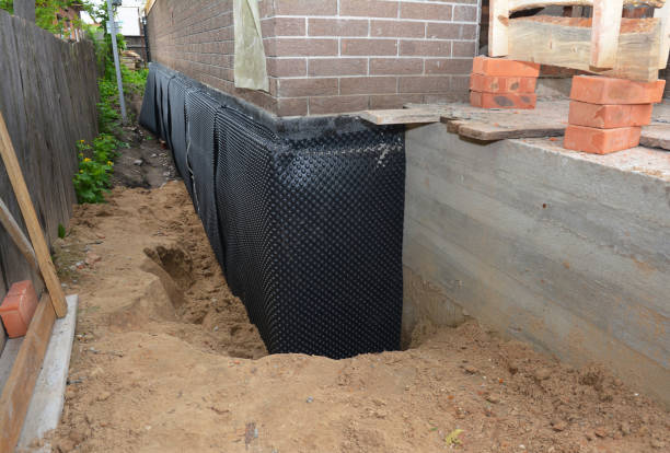 SJ Waterproofing Pros technician performing targeted Interior Drainage System assessment in Toney, AL